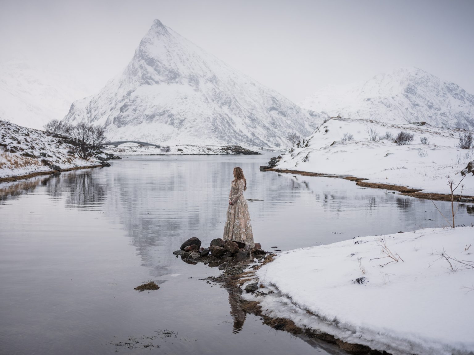 Mountains reflected in still water, a Lofoten winter elopement