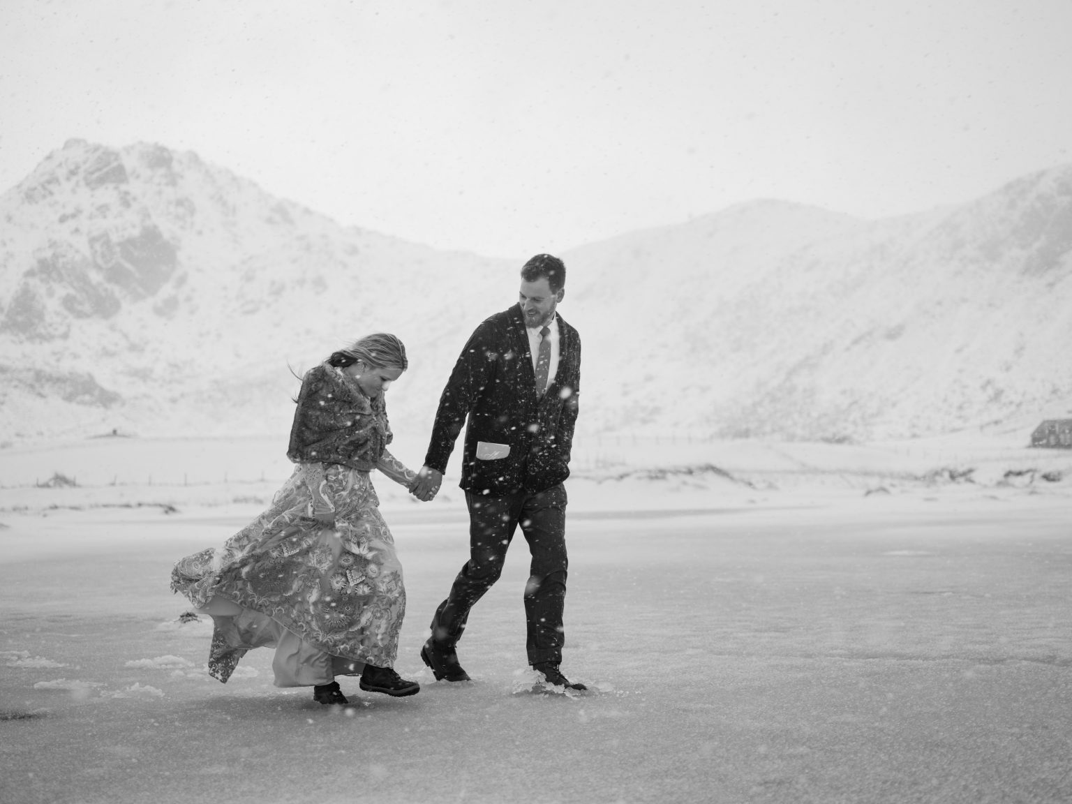 Walking a windswept winter beach, Lofoten