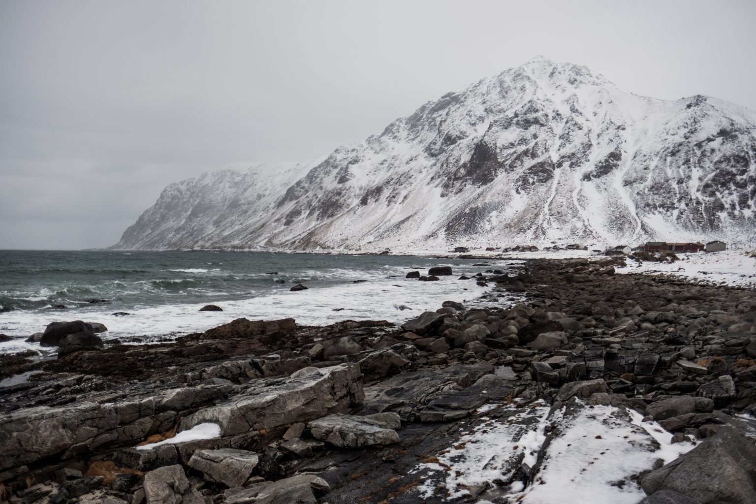 Snow-covered peaks above the sea, Lofoten, Norway