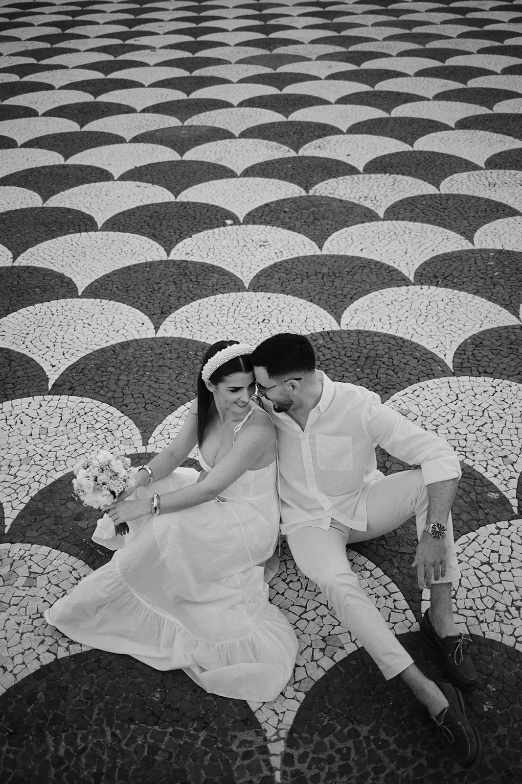 Mónica and Nuno on the black-and-white cobbles of a Funchal square, Madeira