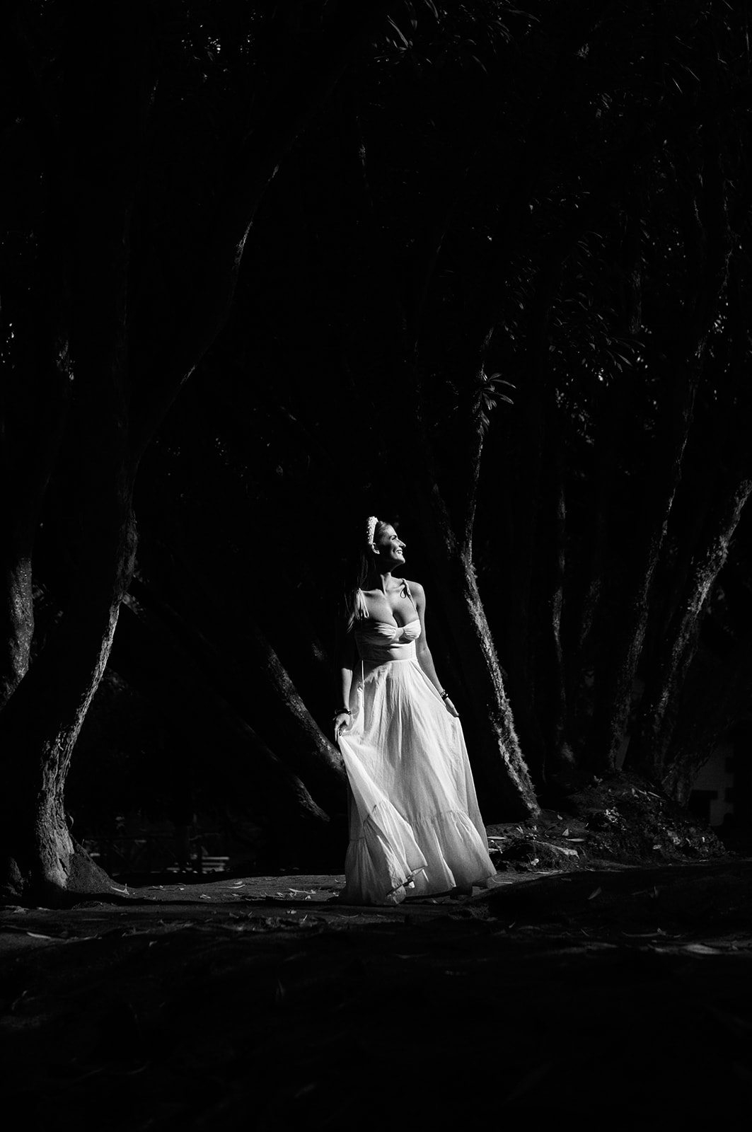Bride with her dress and veil among the trees at Queimadas, Madeira