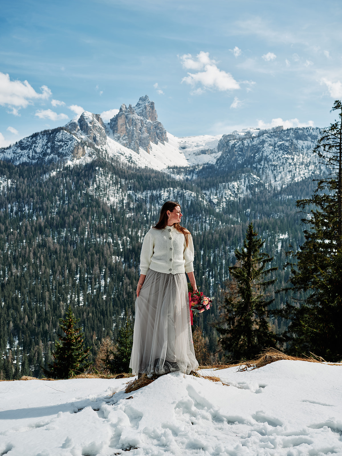 Bride portrait in the snow at a Passo Gardena winter wedding, Val Gardena Dolomites - Nordica Photography