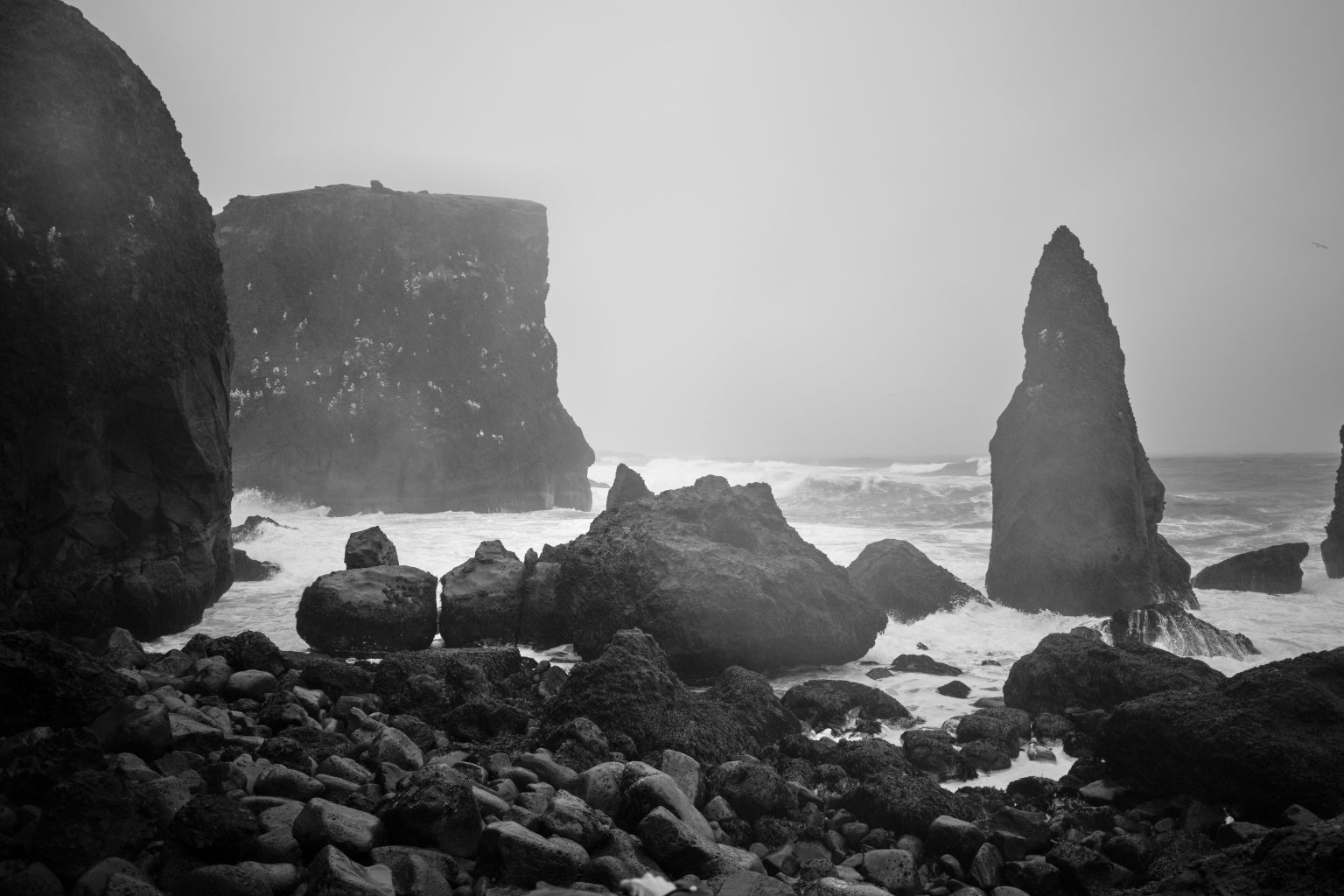 Sea stacks and surf on the Reykjanes coast, black and white