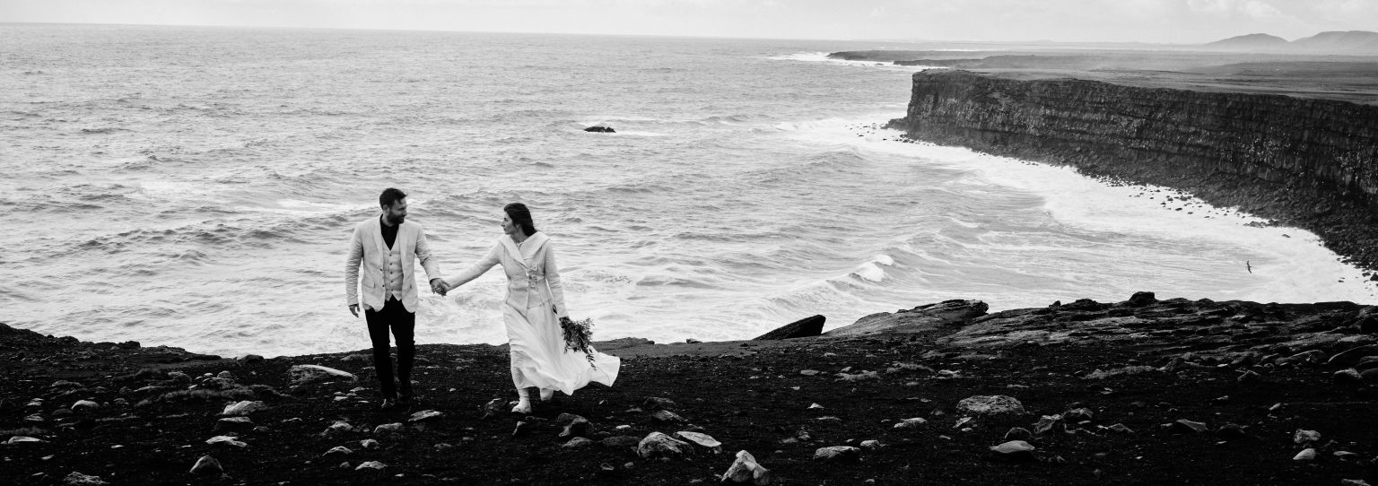Andreea and Matthias on the black beach below the cliffs, Reykjanes