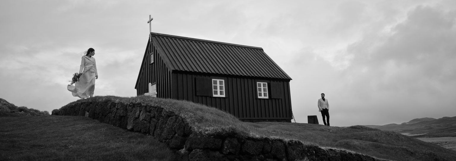 Bride walking to Krýsuvíkurkirkja, the black church on Reykjanes