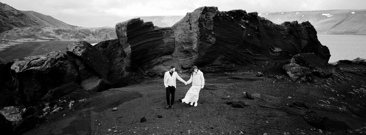 The couple among rock formations near Kleifarvatn