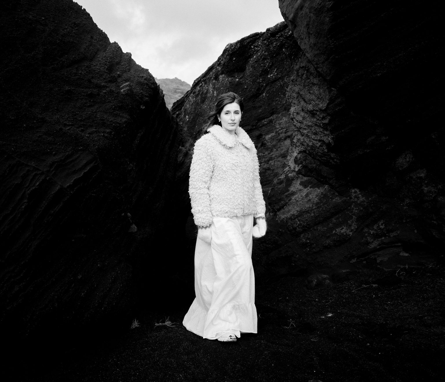 Bride in a dark rock cleft, Reykjanes, black and white