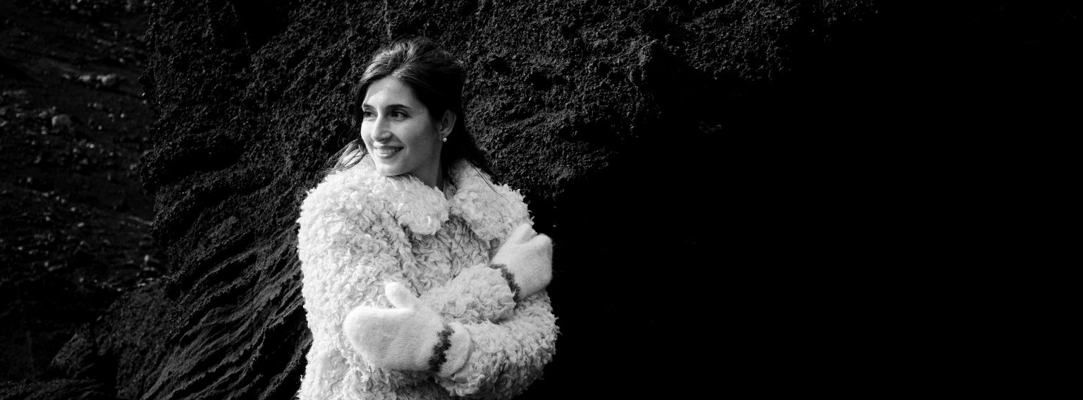 Bride with her bouquet in a dark rock cleft, Reykjanes