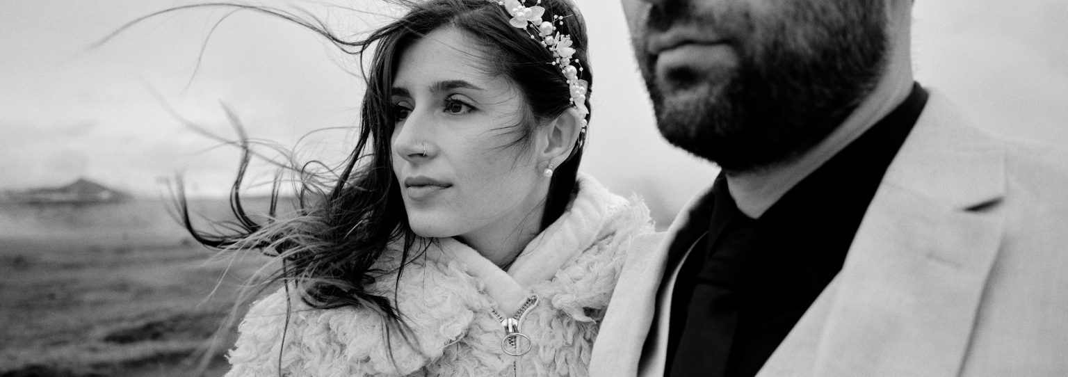 Windswept portrait of the couple on the Reykjanes peninsula