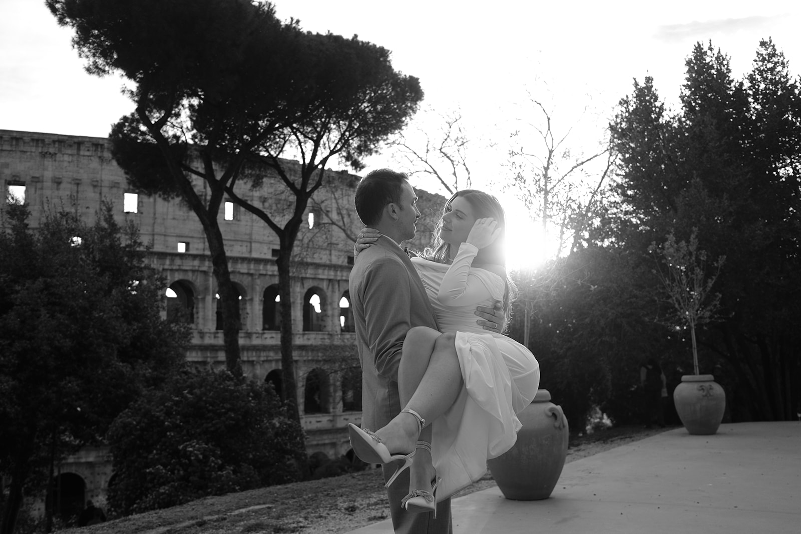 Couple in golden light beside the Colosseum, Rome