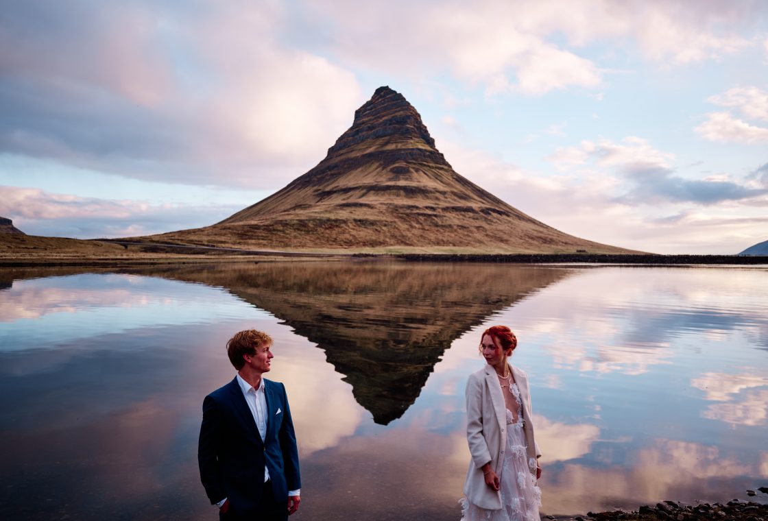 Kirkjufell mirrored in the water at sunrise on a Snæfellsnes elopement