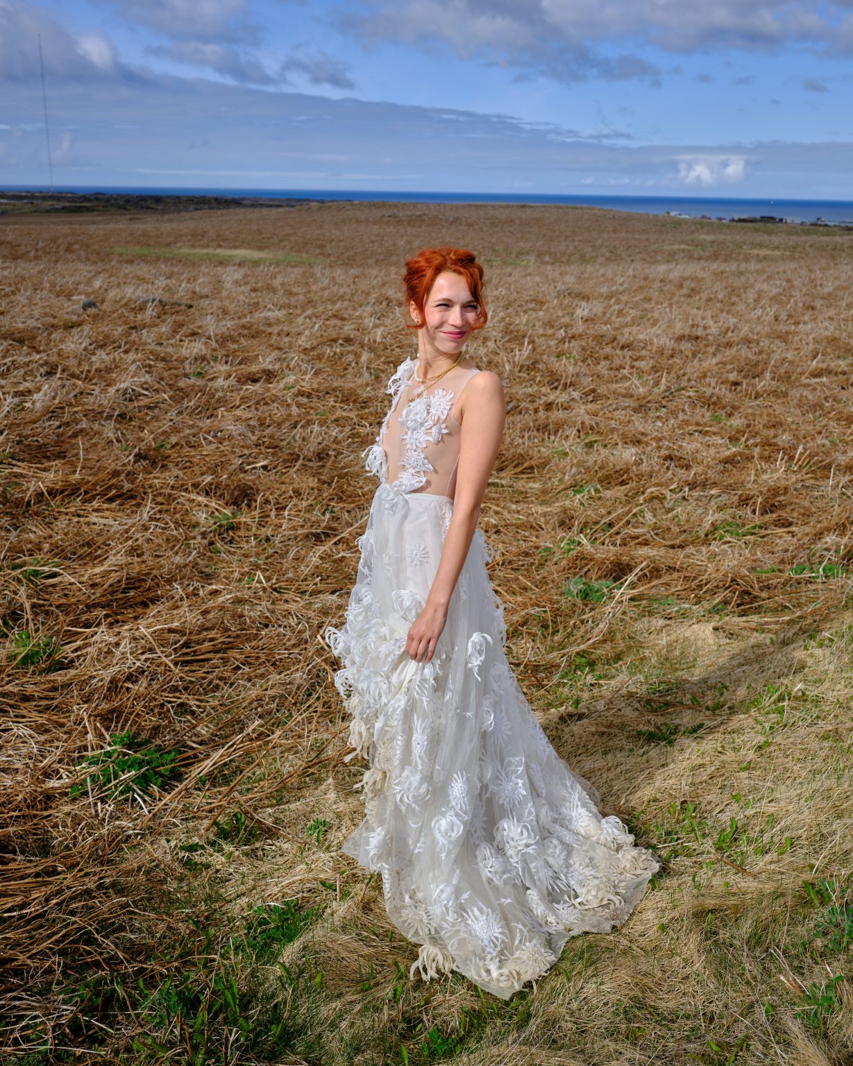 Bride in a coastal field on the Snæfellsnes peninsula