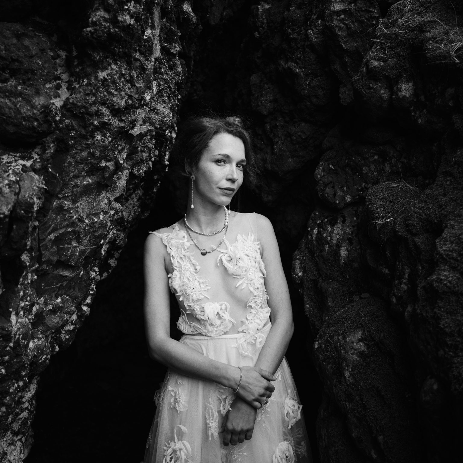 Bride portrait in a basalt cleft at Arnarstapi