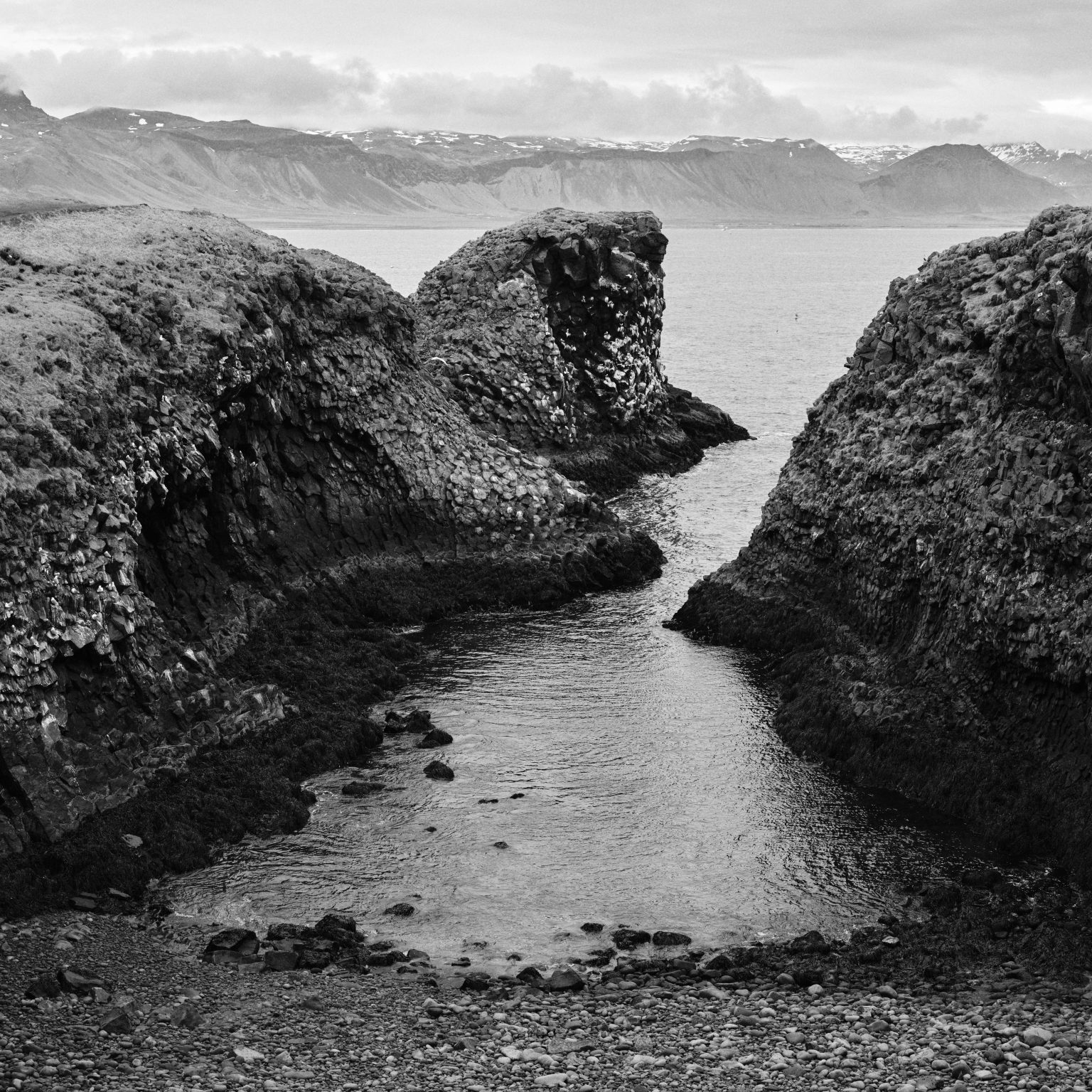 Basalt sea stacks and fjord view at Arnarstapi, Snæfellsnes
