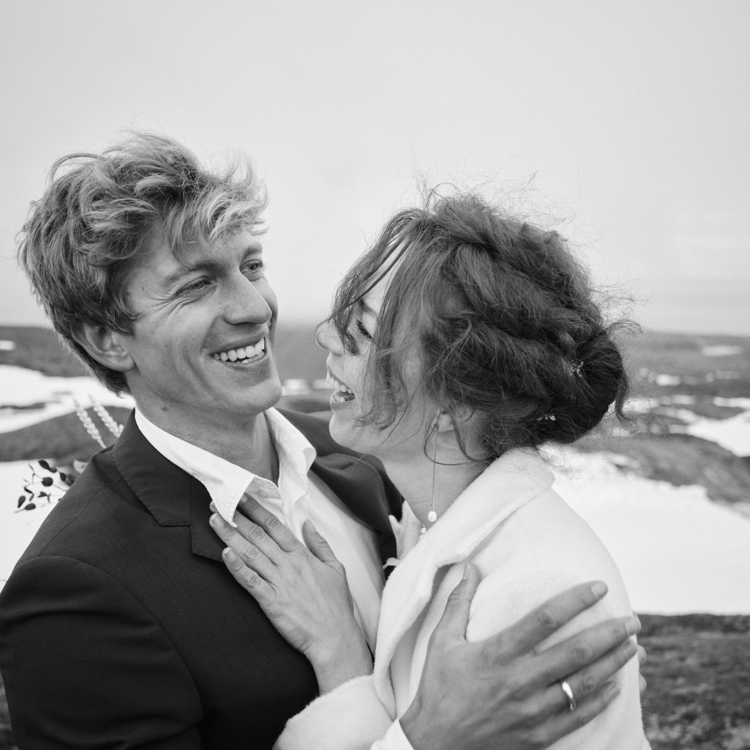 The couple close together in the wind on Snæfellsjökull glacier