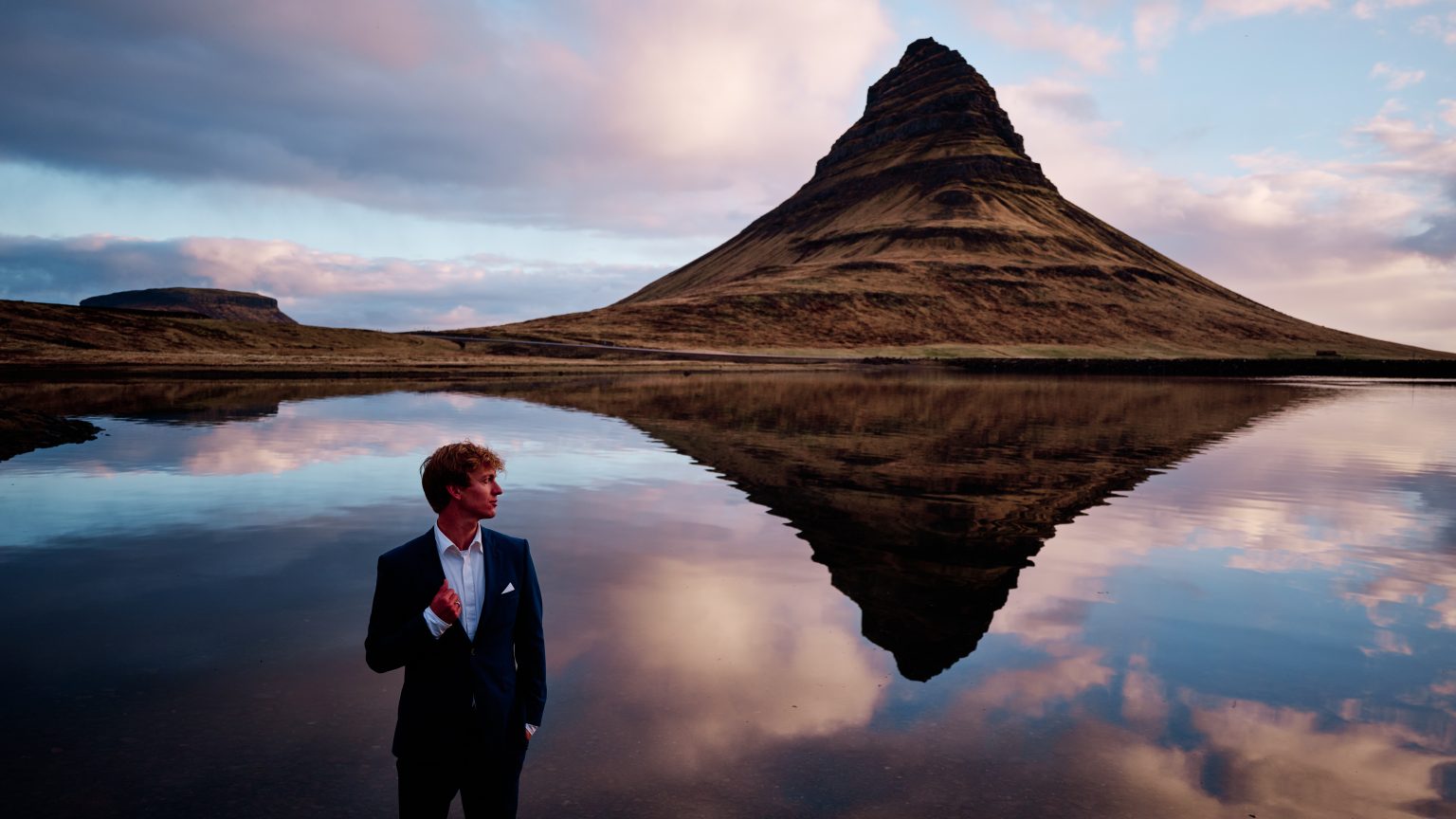 Kirkjufell reflected in still water at sunrise, Snæfellsnes