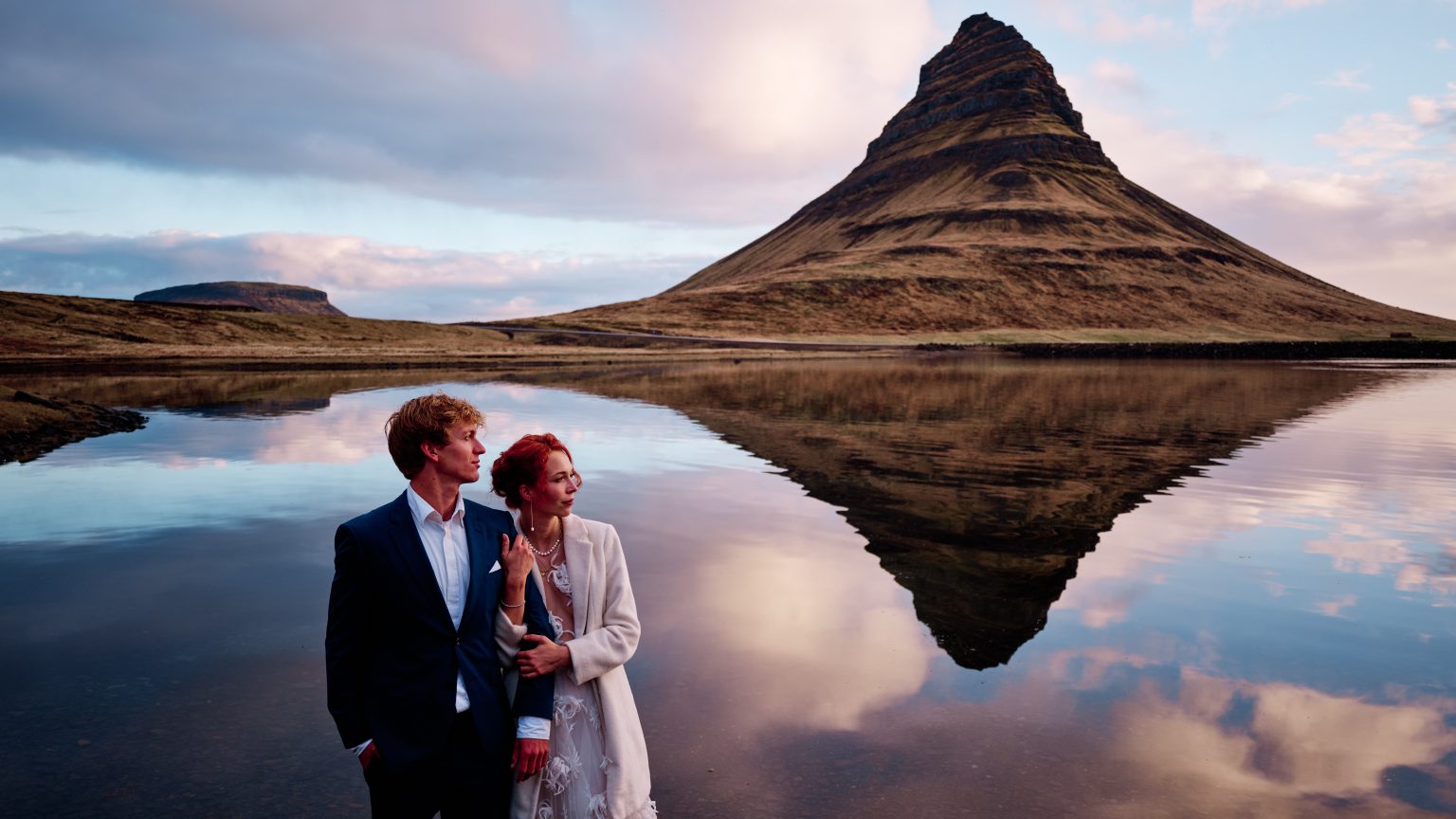 Anna and Niklas with Kirkjufell reflected behind them