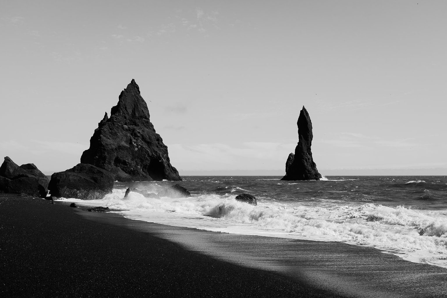 Bride on the black sand beach at Reynisfjara, South Iceland elopement