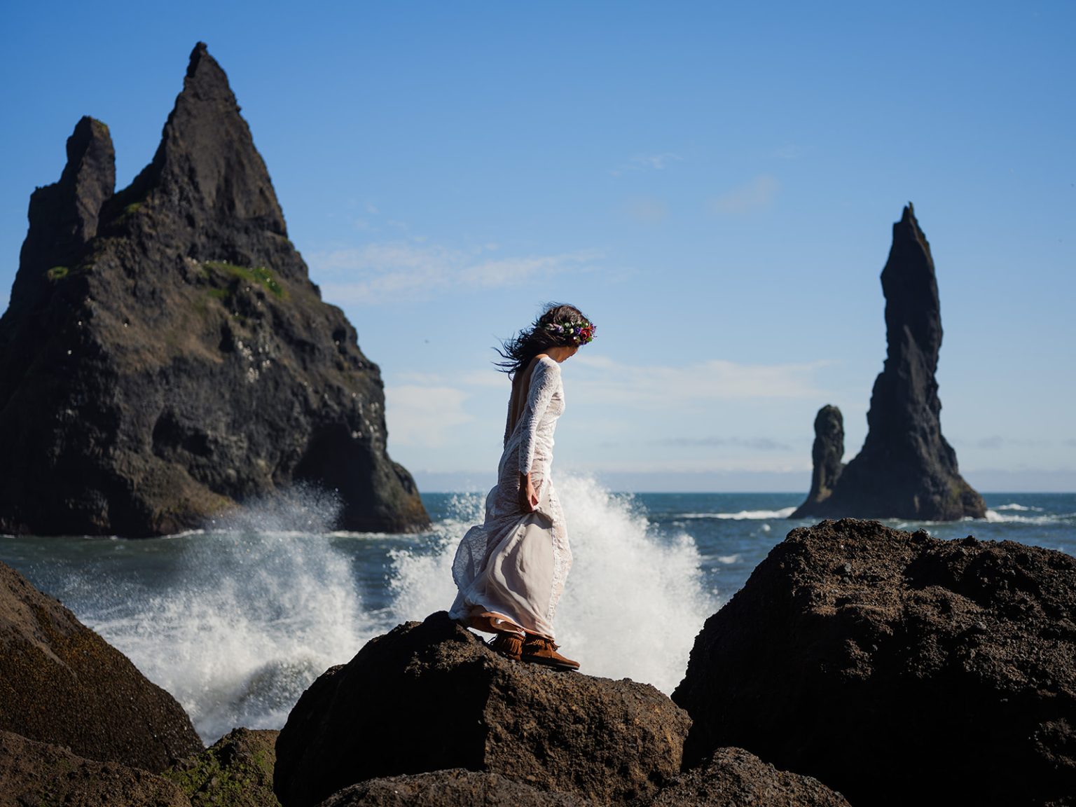Bride with her hair in the wind at Reynisfjara, South Iceland elopement portrait