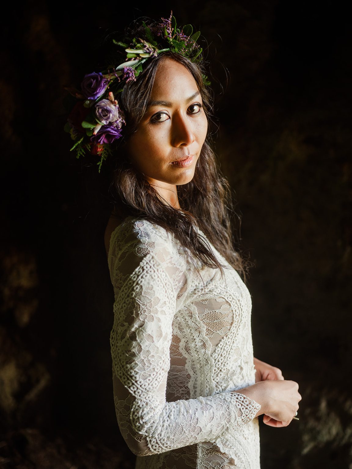 Bride in her flower crown on the Dyrholaey headland, South Iceland elopement
