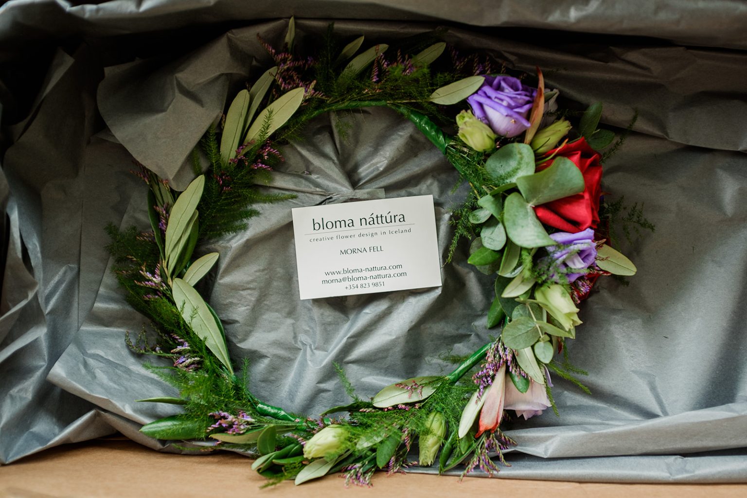 Wedding bouquet and flower crown laid out before a South Iceland elopement
