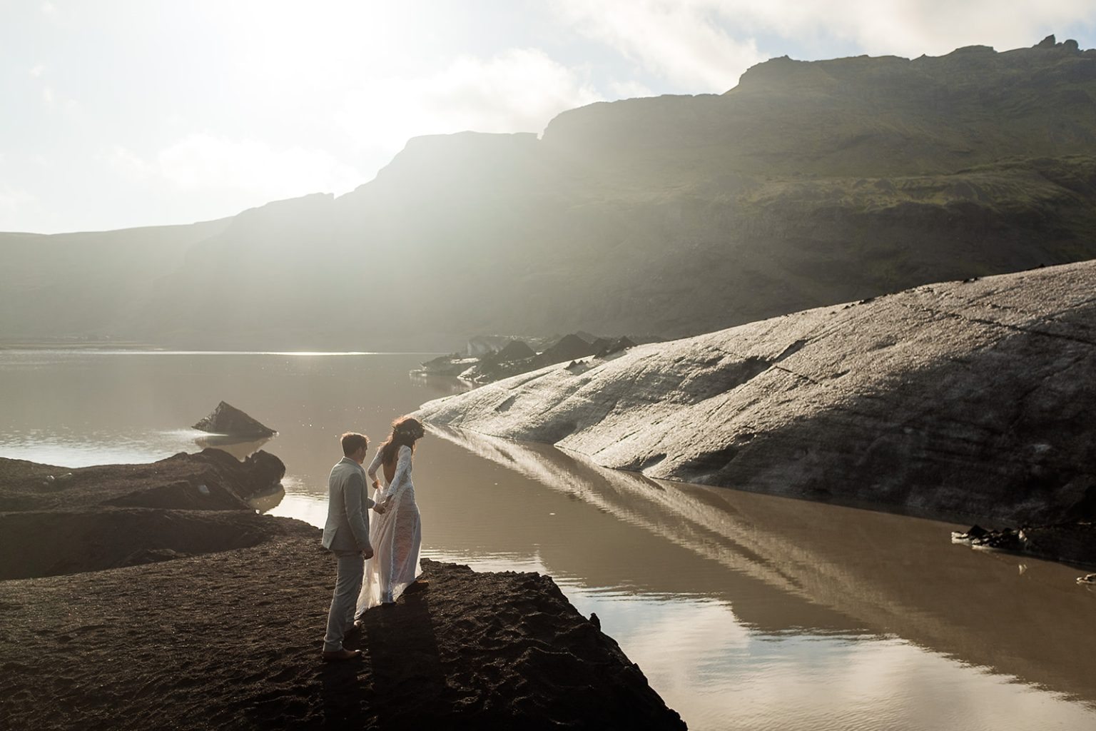 Bride and groom in silhouette at the glacier lagoon, South Iceland elopement