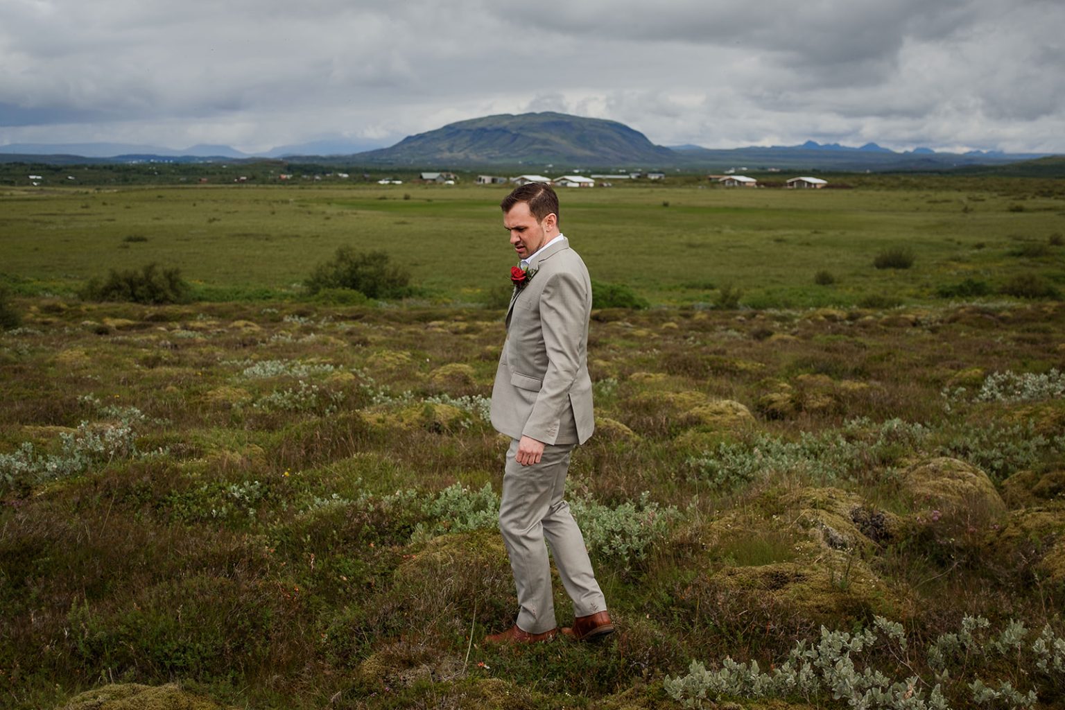 Bride walking through green moss, South Iceland elopement portraits
