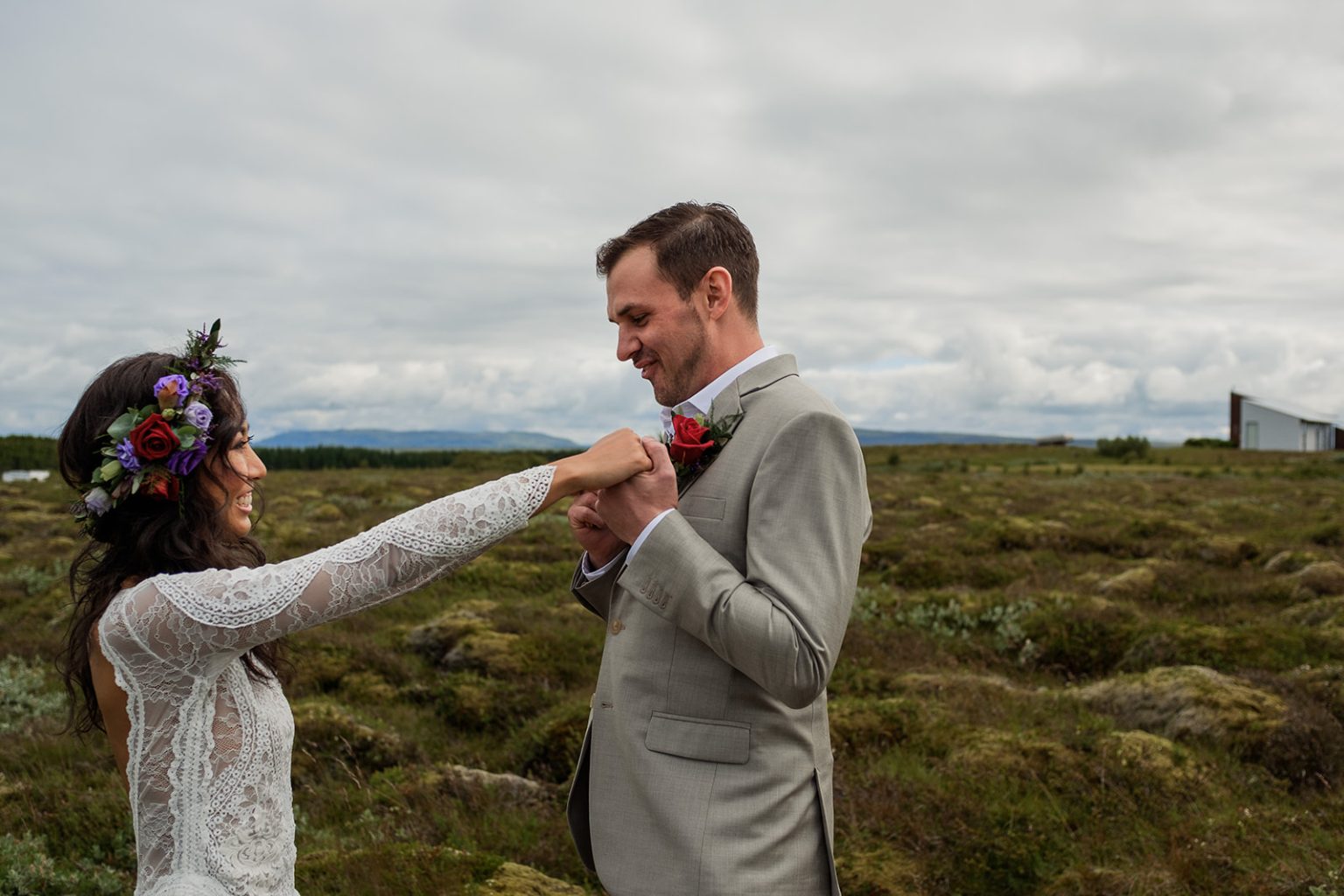 Couple dancing in a moss field during a South Iceland elopement