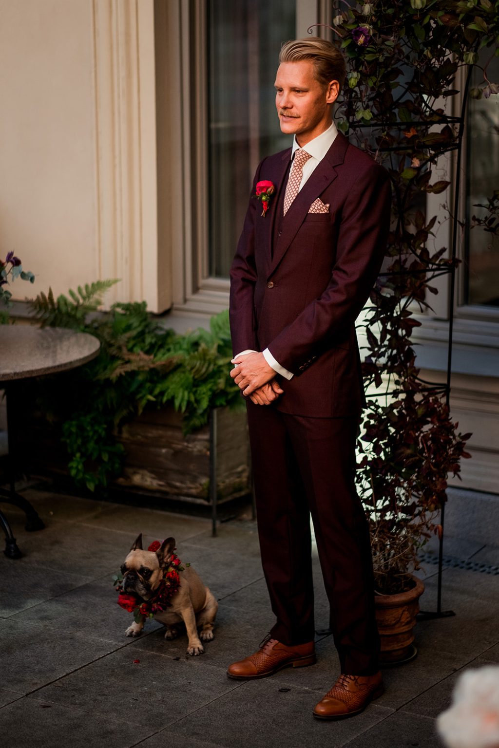 The groom waiting in the courtyard of the Lydmar Hotel