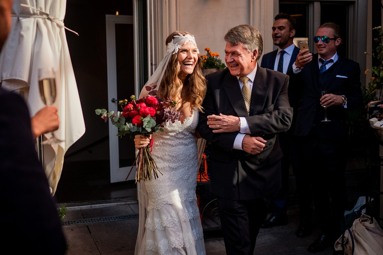 Walking out through a shower of petals at the Lydmar Hotel
