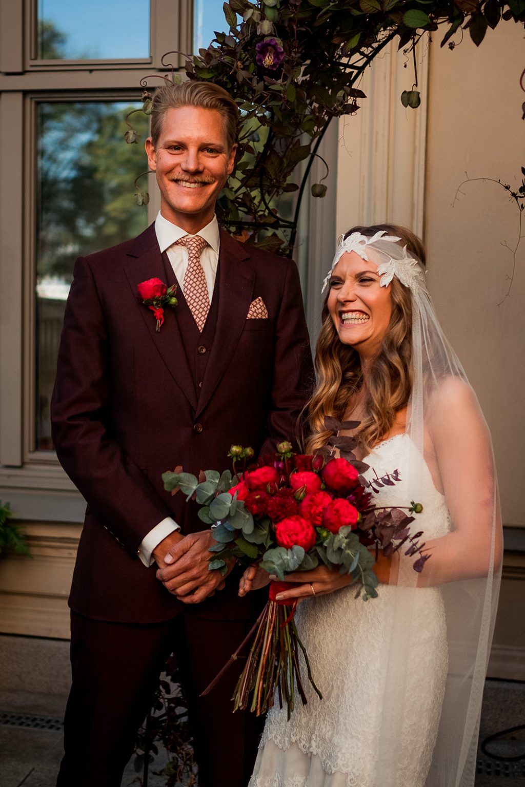 Bride and groom laughing in the Lydmar courtyard