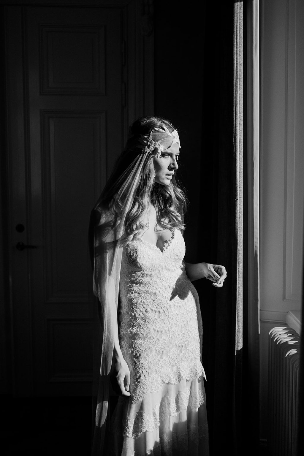 Editorial bride portrait in window light in Stockholm