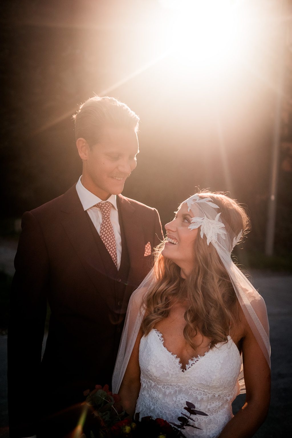 Bride and groom backlit in the Stockholm evening light