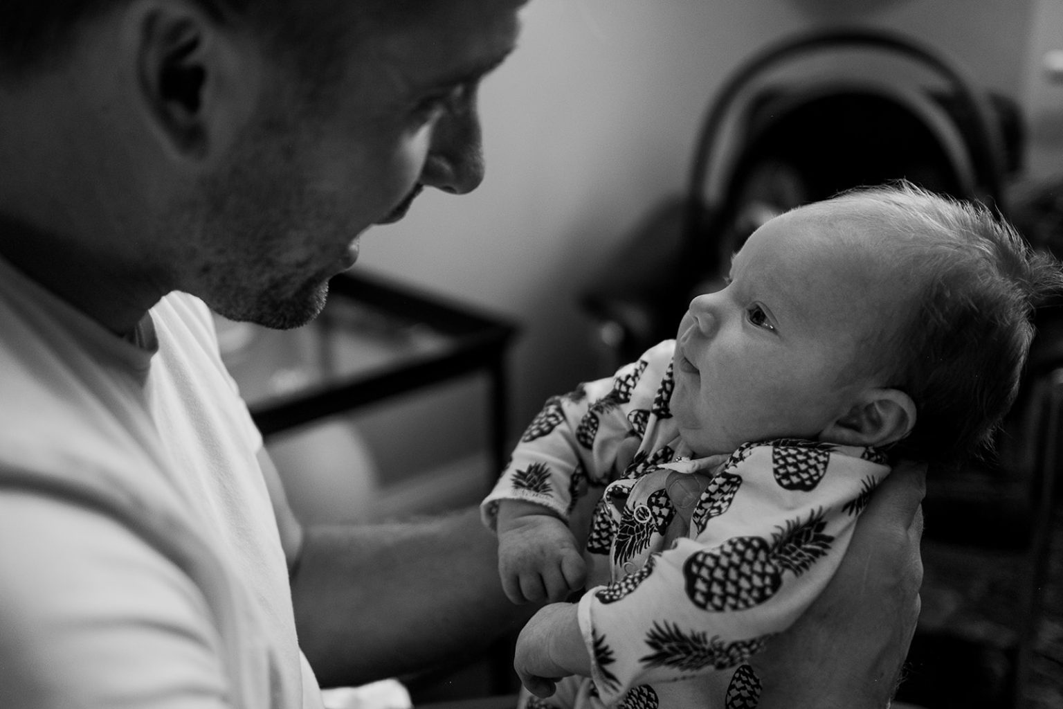 A father and baby during the morning of the wedding