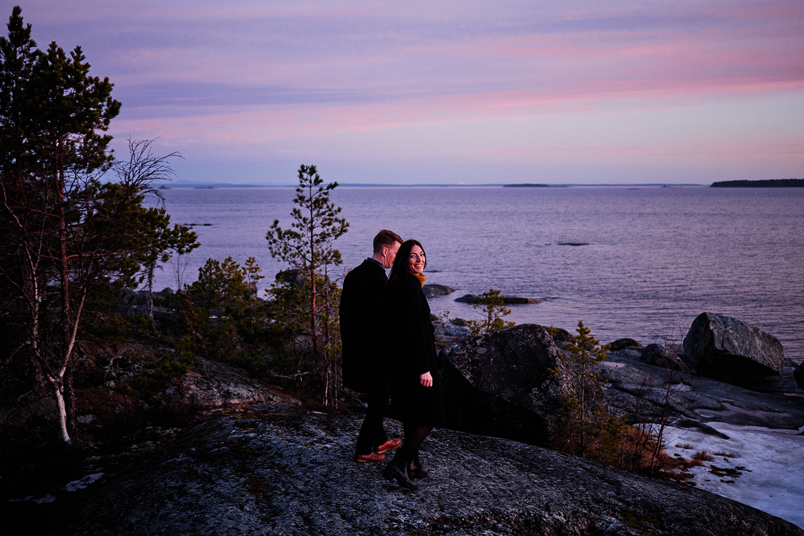 Engaged couple on the rocks at dawn on the Baltic coast, Söderhamn Sweden - Nordica Photography