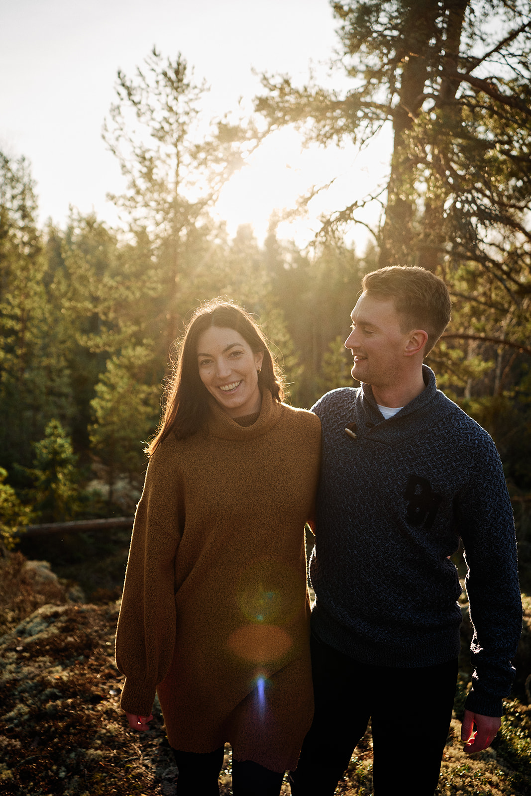 Couple laughing in the forest at Hop Farm Beach, Söderhamn Sweden - Nordica Photography