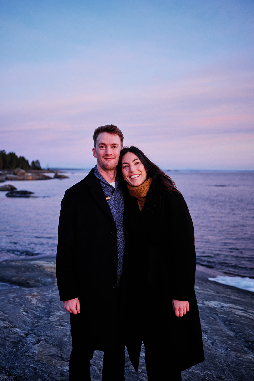 Engaged couple at sunrise on the Baltic shore near Hop Farm Beach, Söderhamn Sweden - Nordica Photography