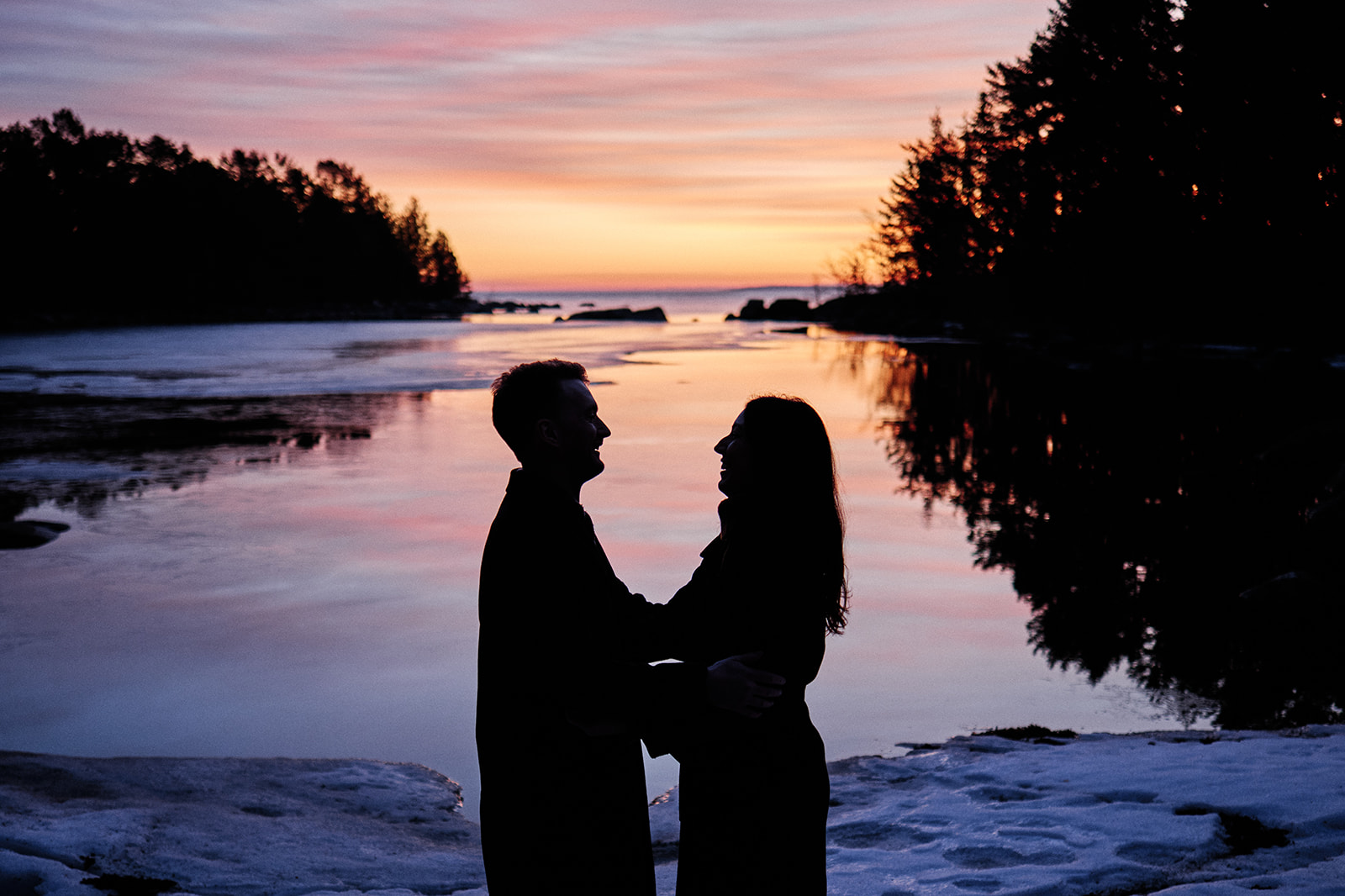 Engaged couple in silhouette at first light on the Baltic coast at Söderhamn, Sweden - Nordica Photography