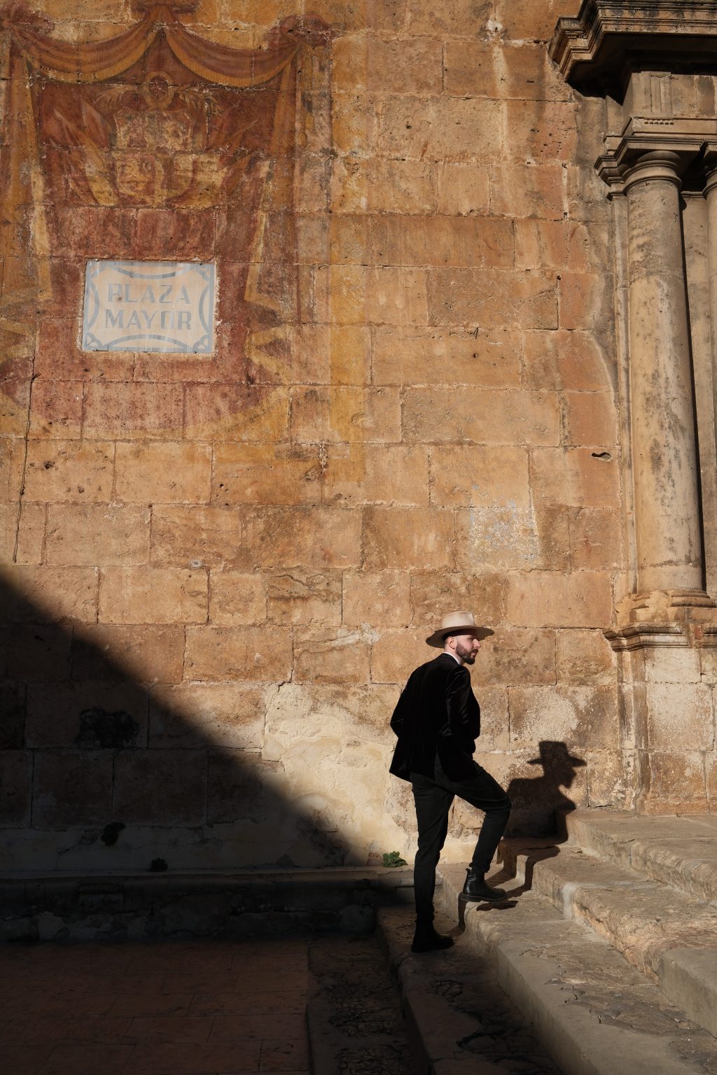 Ondrej setting up beside an old stone wall, Valencia