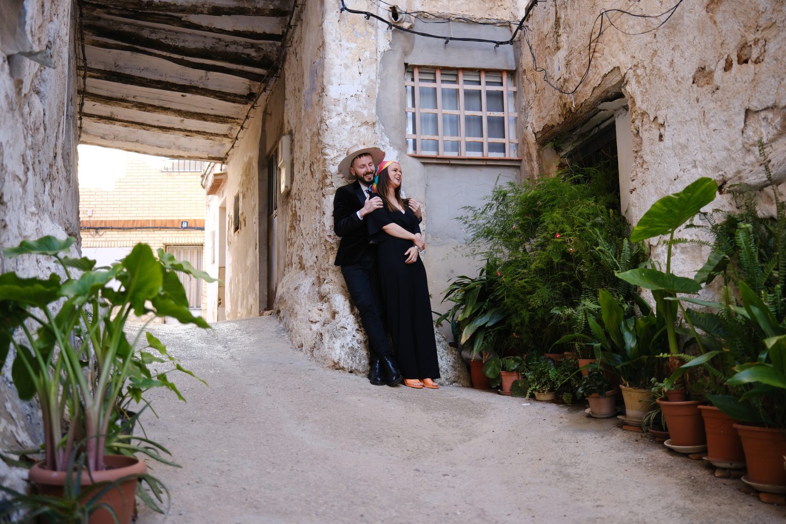 Adriana and Ondrej in a plant-filled corner in Chelva, Valencia