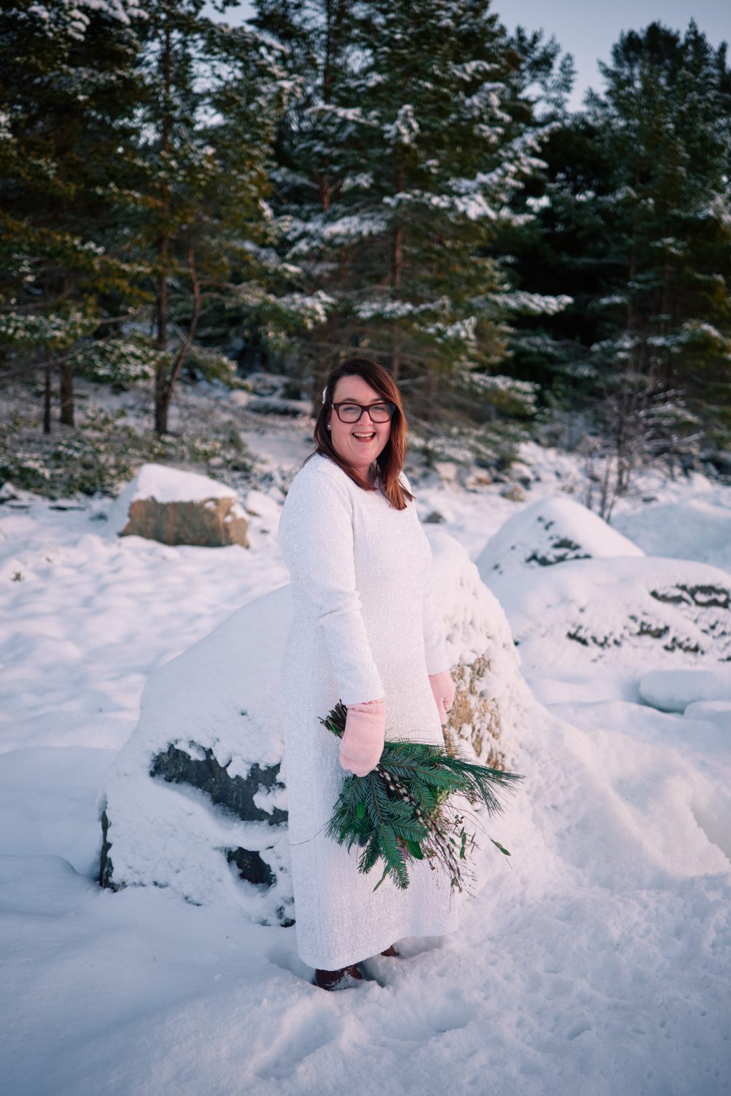 The bride on the snowy shoreline, a winter elopement in Sweden