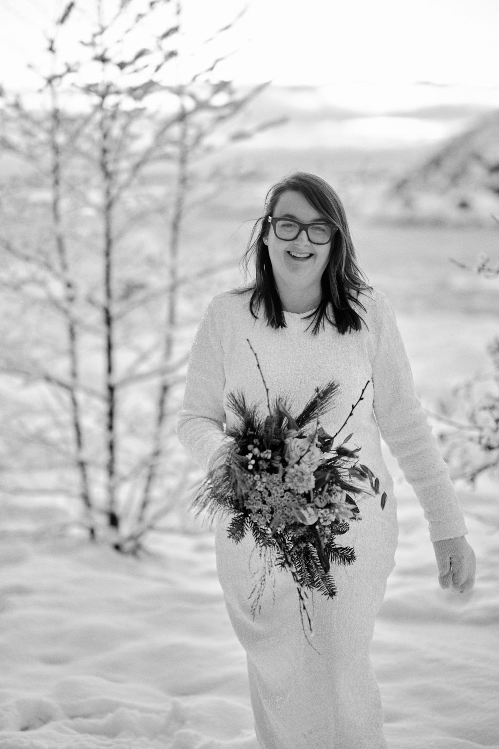 The bride in black and white among winter birches, Sweden