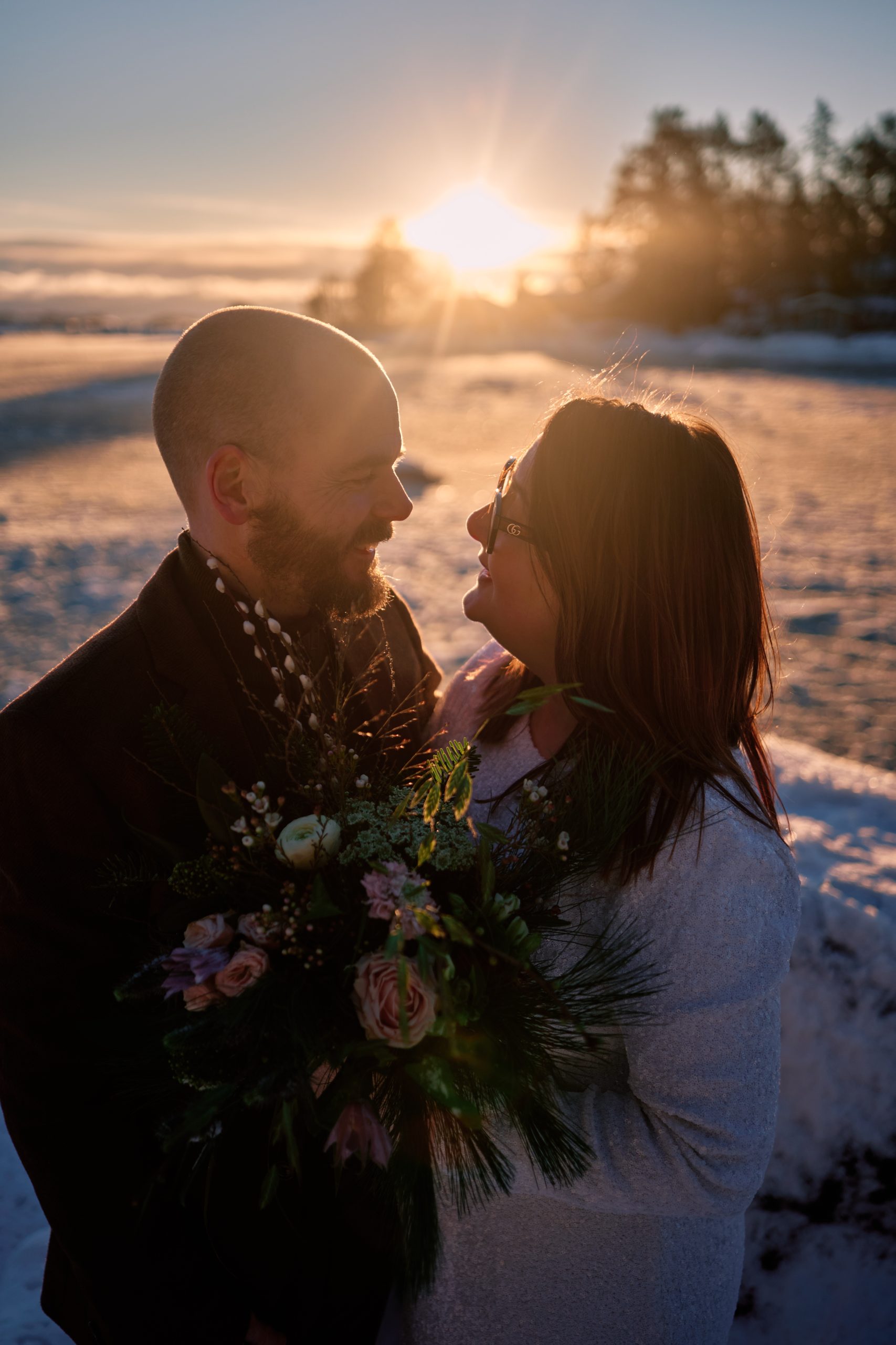 Sam and Rob together in the winter light, a Nordic winter elopement