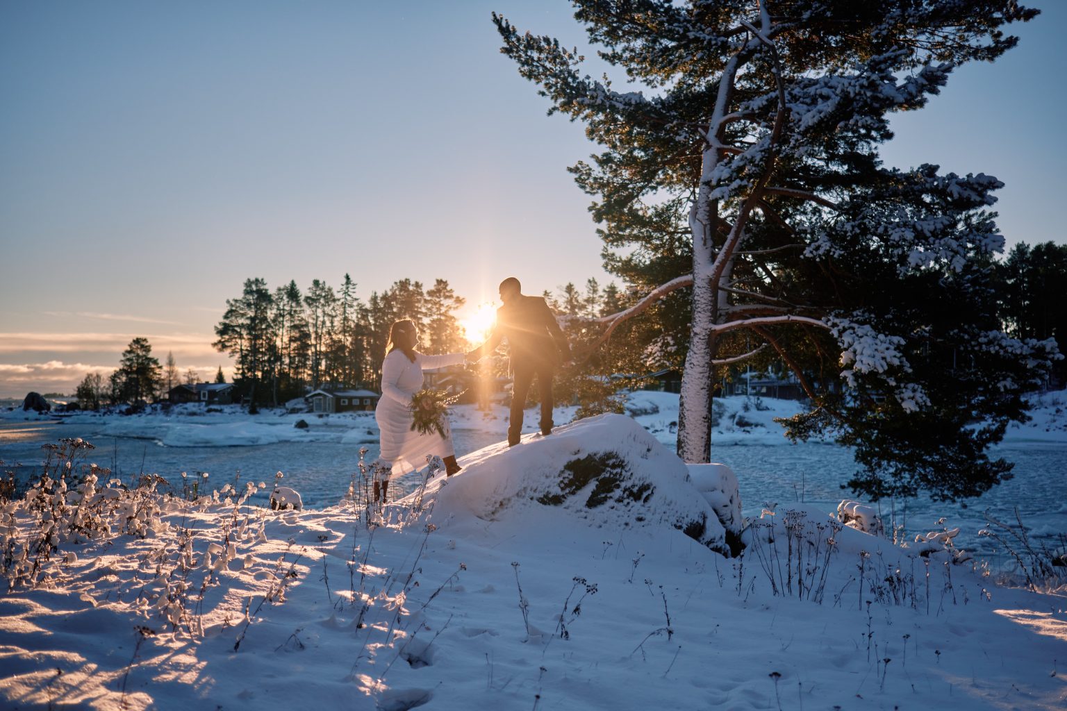 An embrace in the low winter light, a Nordic elopement