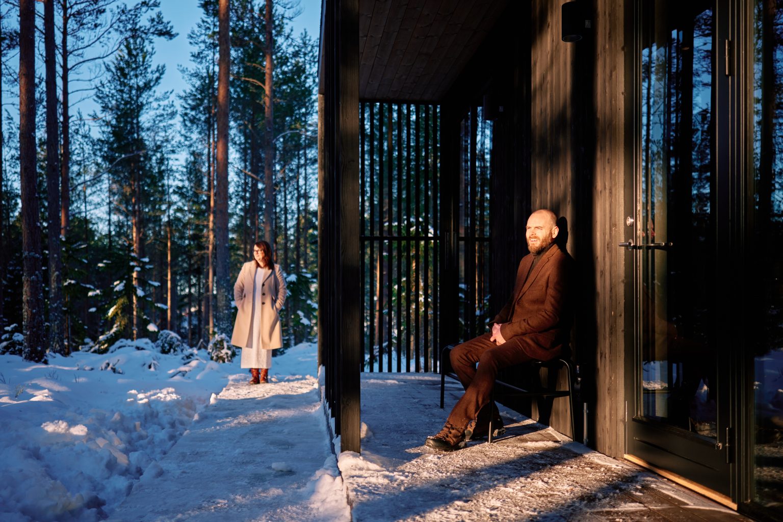 The cabin's glass and timber in the snow, Hop Farm Beach