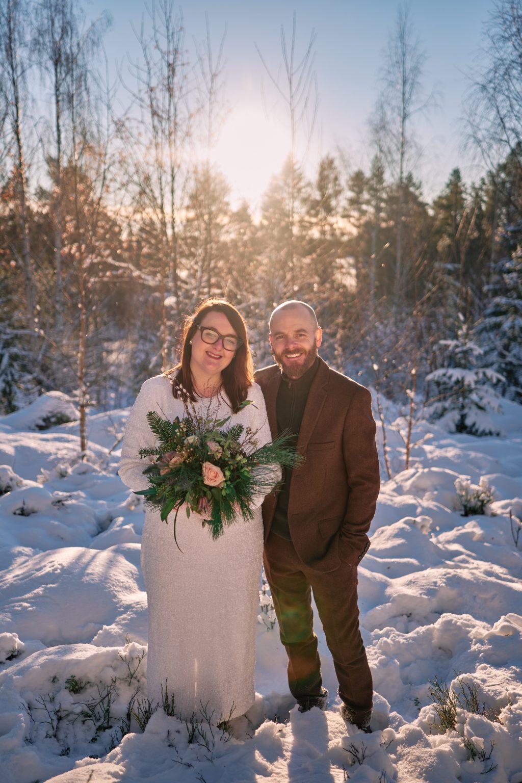 Sam and Rob in the snow and sun, a winter elopement in Sweden