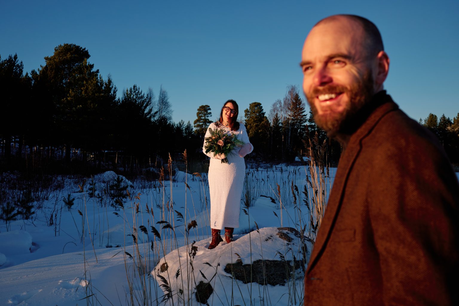 The groom in the winter light, a Sweden winter elopement