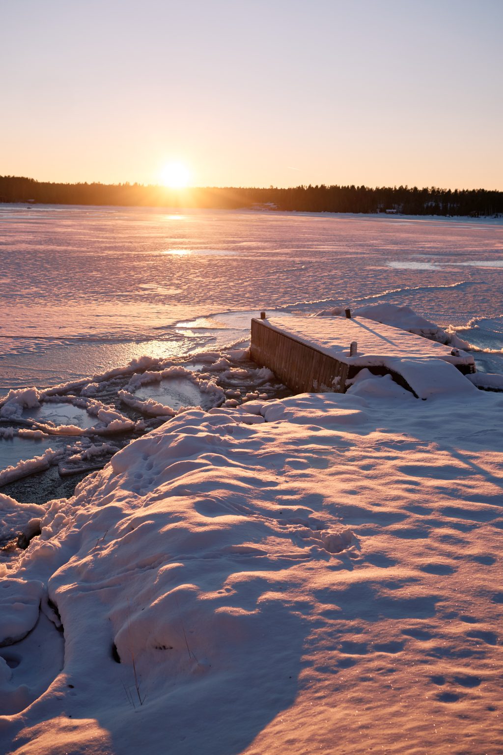Sunset over the frozen sea, Nordic winter, Sweden