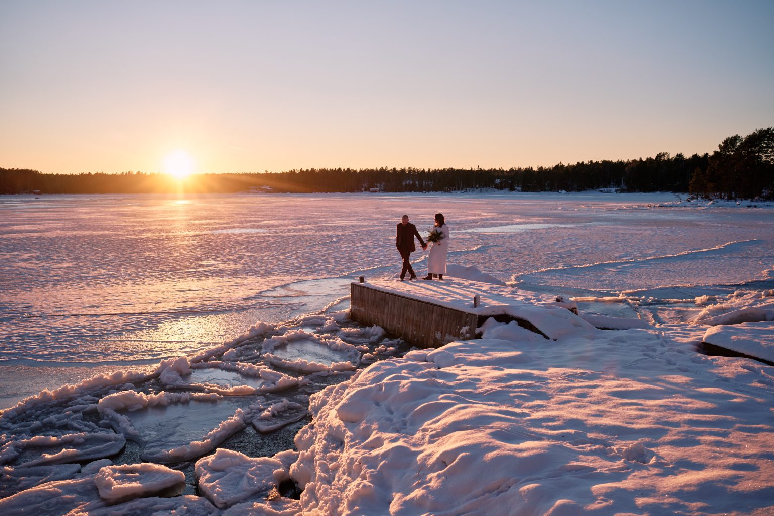 Last light on the frozen shore, a Swedish winter elopement