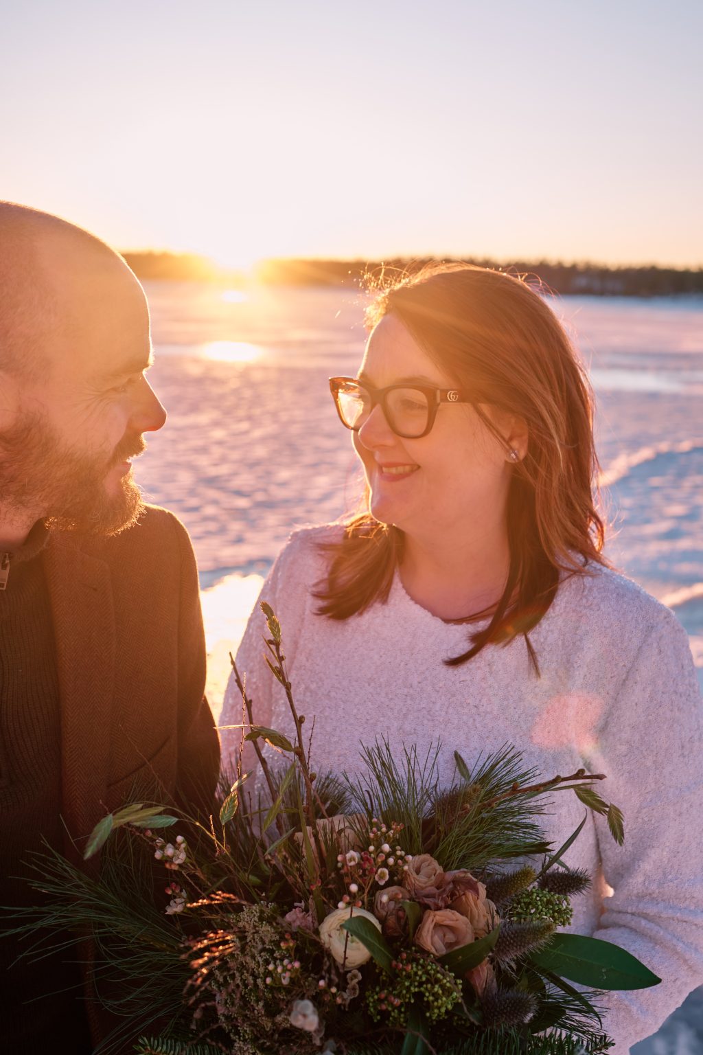 Sam and Rob in the last winter sun, elope in Sweden